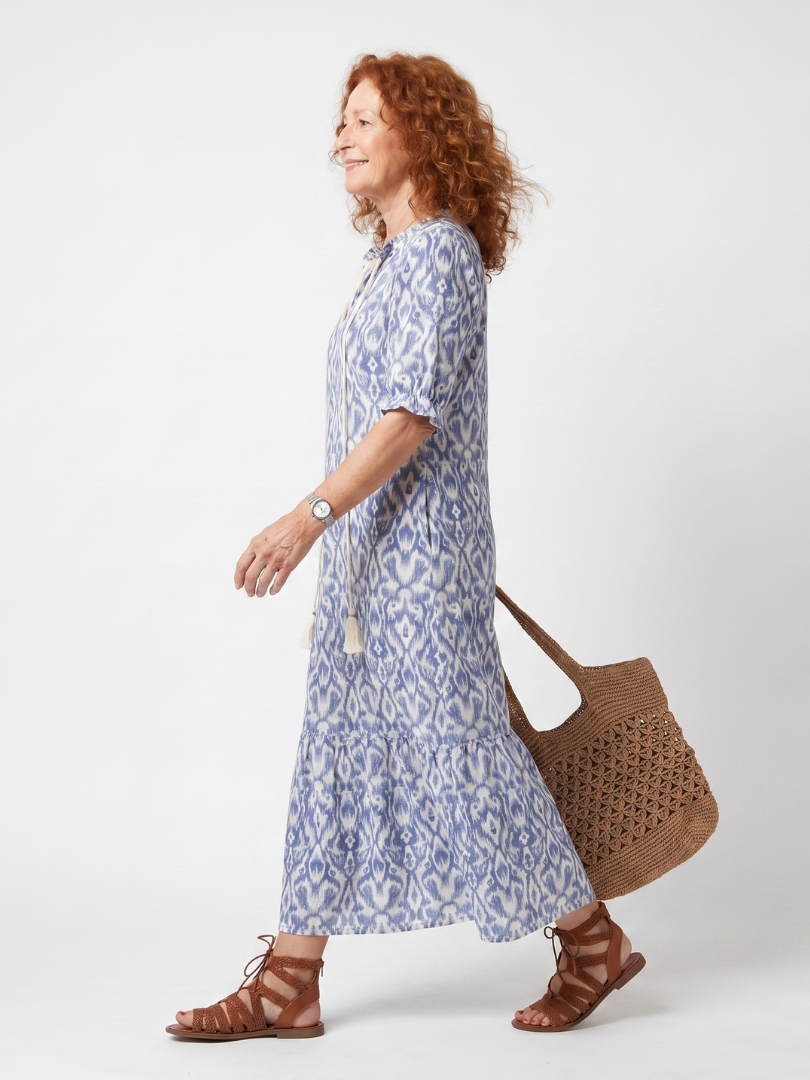 Printed Midi Dress with Tie Neck and Pom Poms